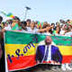 Suporters of Ethiopian Prime Minister Abiy Ahmed cheer just before an explosion rocked a massive rally to support him in Meskel Square in Addis Ababa, Ethiopia, 23 June 2018. Reports say the blast occurred shortly after Abiy addressed thousands of his supporters. Abiy says a few people have been killed. Explosion rocks a rally in Ethiopia, Addis Ababa - 23 Jun 2018